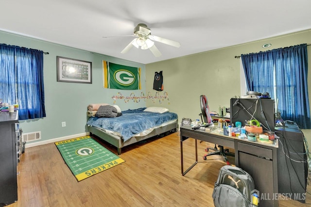 bedroom featuring hardwood / wood-style floors and ceiling fan