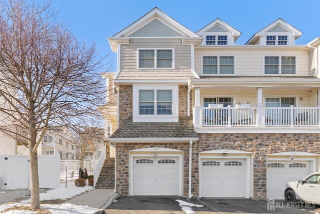 townhome / multi-family property featuring a garage