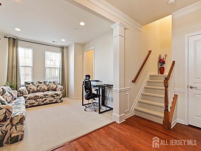 living room with wood finished floors, visible vents, decorative columns, recessed lighting, and ornamental molding