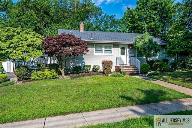 20 Melville Rd, Edison, NJ 08817 - view of front facade featuring a front yard and a chimney