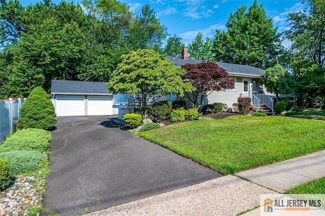 20 Melville Rd, Edison, NJ 08817 - view of front of property featuring an outdoor structure, a front yard, a chimney, and a detached garage