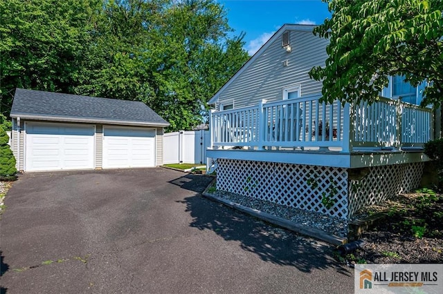 20 Melville Rd, Edison, NJ 08817 - view of side of property with a deck, an outdoor structure, a garage, and a gate