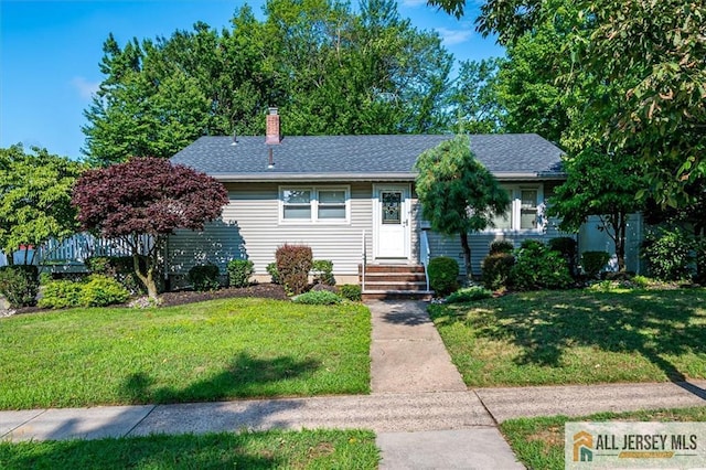 20 Melville Rd, Edison, NJ 08817 - view of front of property with a front yard, a chimney, and roof with shingles