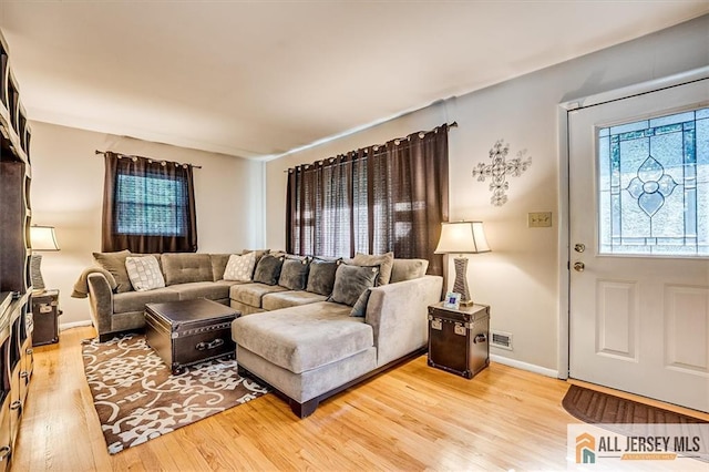 20 Melville Rd, Edison, NJ 08817 - living area with light wood finished floors and baseboards