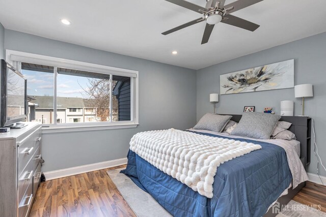 bedroom with ceiling fan, recessed lighting, dark wood finished floors, and baseboards