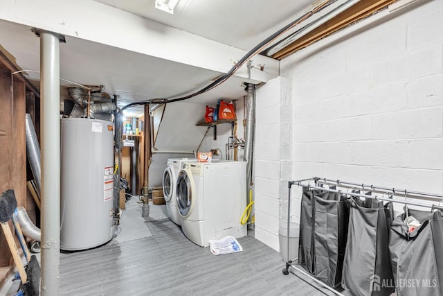 laundry area with washer and clothes dryer and gas water heater