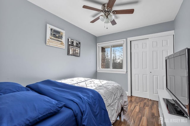 bedroom with ceiling fan, dark hardwood / wood-style floors, and a closet