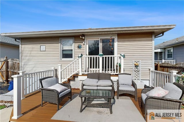 exterior space featuring fence and an outdoor living space