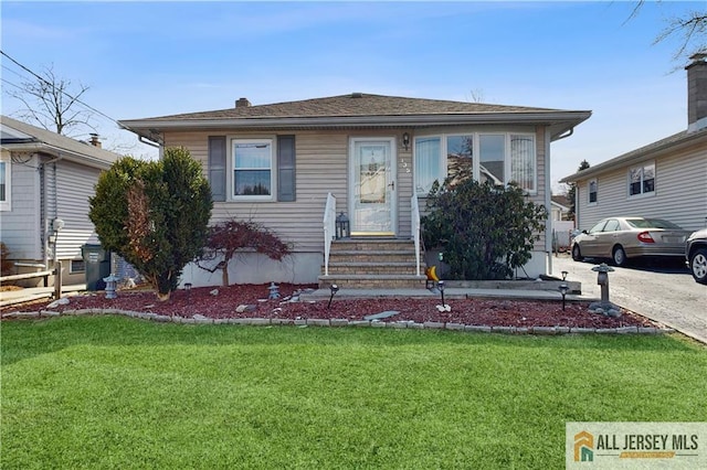 bungalow with a front lawn