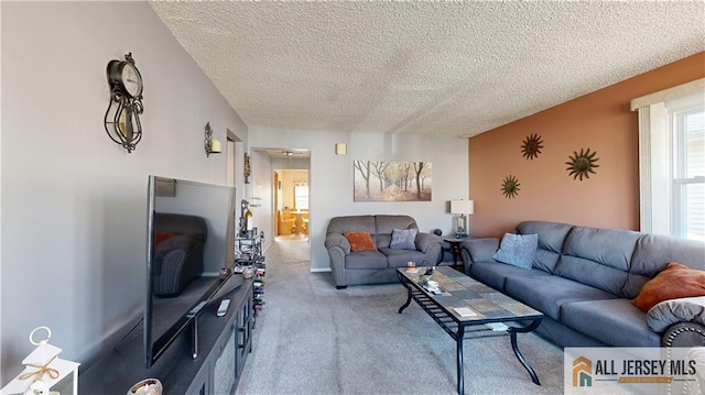 living room with light carpet and a textured ceiling