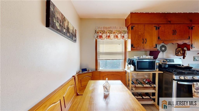 kitchen with stainless steel appliances and brown cabinets