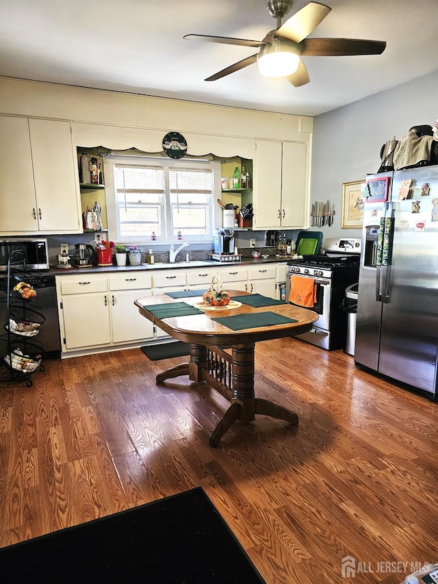 402 Raritan Ave, Middlesex, NJ 08846 - kitchen featuring stainless steel appliances, open shelves, dark countertops, and white cabinets