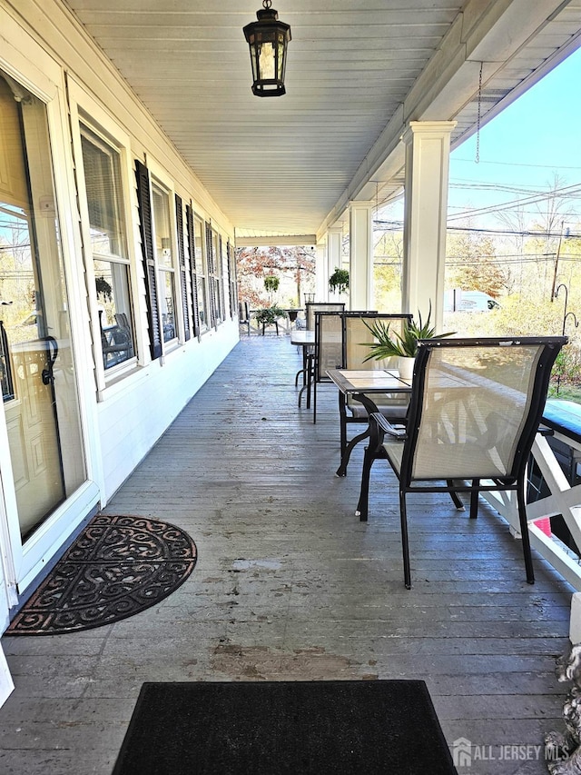 402 Raritan Ave, Middlesex, NJ 08846 - sunroom featuring outdoor dining space and wood finished floors