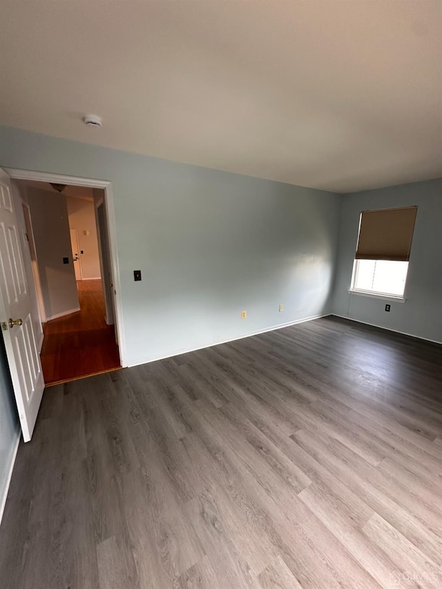 empty room featuring wood-type flooring