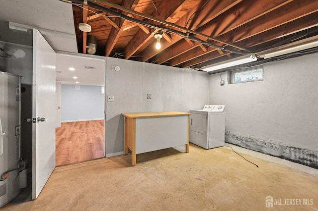 basement featuring visible vents and washer / clothes dryer