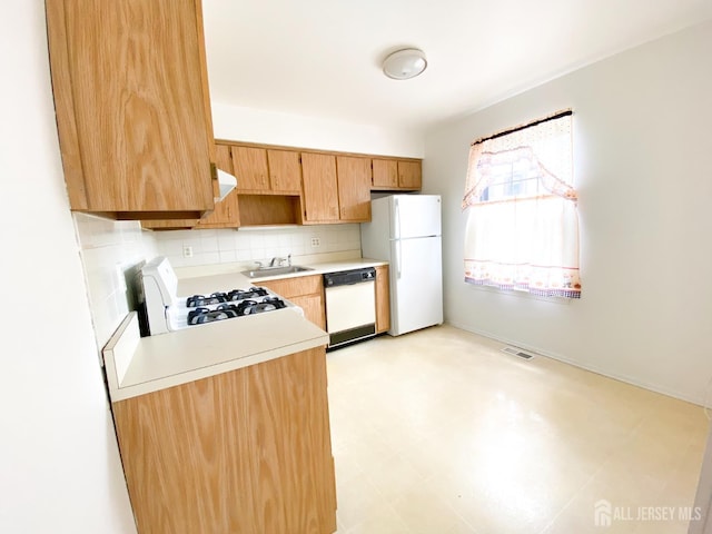 33 Foxhall St Unit B, Middlesex, NJ 08846 - kitchen with white appliances, light countertops, backsplash, light floors, and extractor fan