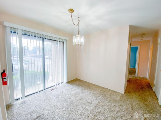 33 Foxhall St Unit B, Middlesex, NJ 08846 - carpeted spare room with healthy amount of natural light and a chandelier