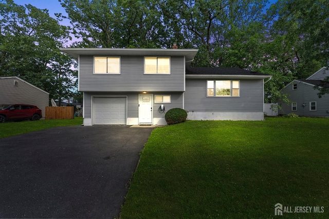 26 Half Acre Rd, Jamesburg, NJ 08831 - view of front facade with asphalt driveway, an attached garage, and a chimney