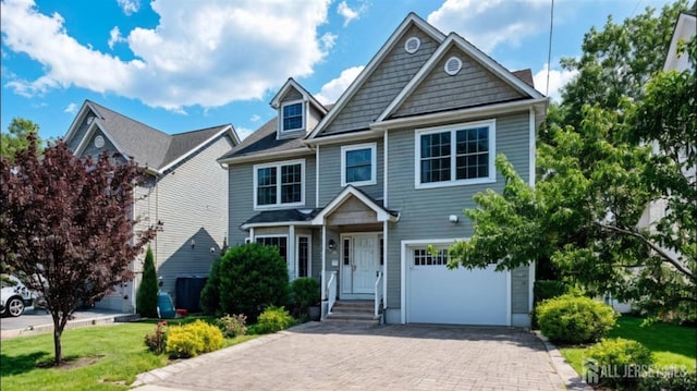 169 Metuchen Ave, Woodbridge Proper, NJ 07095 - view of front of property with an attached garage, decorative driveway, and a front yard