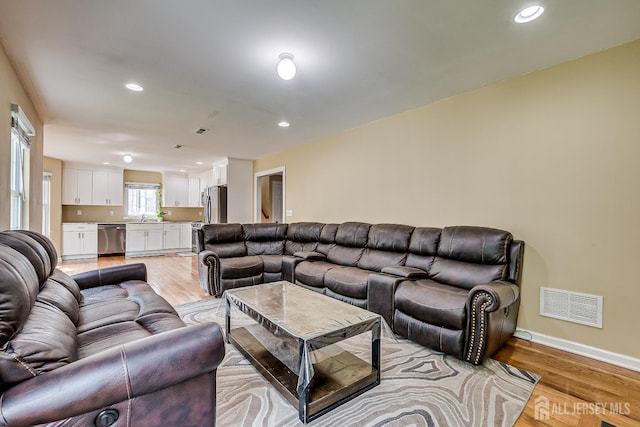 169 Metuchen Ave, Woodbridge Proper, NJ 07095 - living area with light wood-style floors and recessed lighting