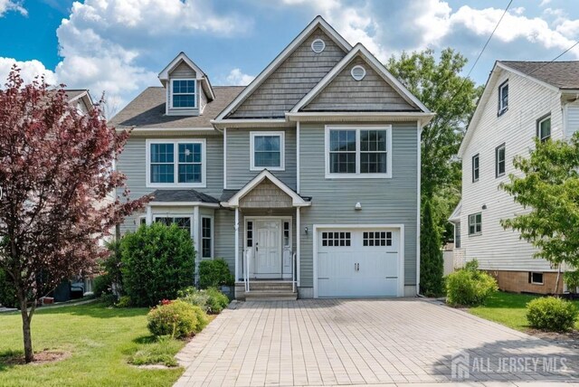 169 Metuchen Ave, Woodbridge Proper, NJ 07095 - view of front of house with a garage, a front yard, and decorative driveway