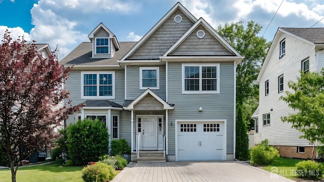 169 Metuchen Ave, Woodbridge Proper, NJ 07095 - view of front of home featuring a garage, driveway, and a front lawn