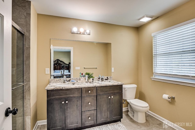 169 Metuchen Ave, Woodbridge Proper, NJ 07095 - ensuite bathroom featuring double vanity, a tile shower, and tile patterned flooring