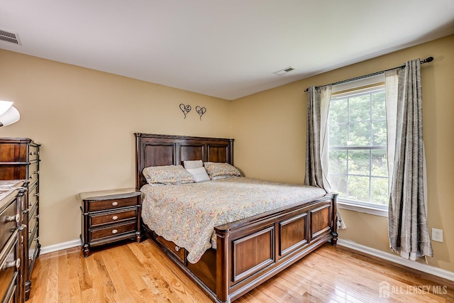 169 Metuchen Ave, Woodbridge Proper, NJ 07095 - bedroom featuring light wood finished floors and multiple windows