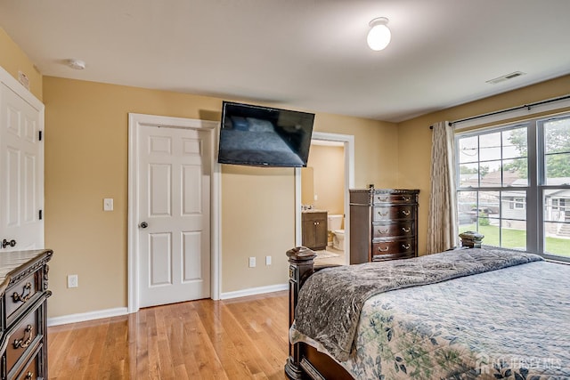 169 Metuchen Ave, Woodbridge Proper, NJ 07095 - bedroom with light wood finished floors and ensuite bathroom