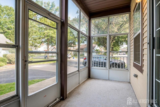 unfurnished sunroom featuring a wealth of natural light