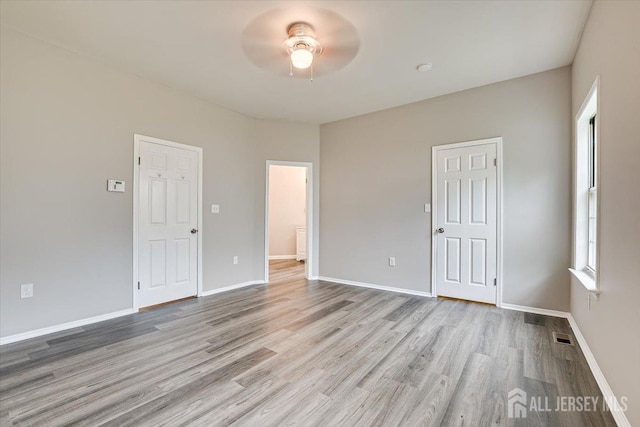 spare room with light wood-type flooring