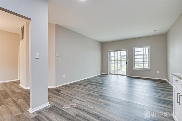 spare room with light hardwood / wood-style flooring