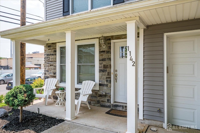 1142 Warren St, Roselle, NJ 07203 - entrance to property featuring covered porch and stone siding