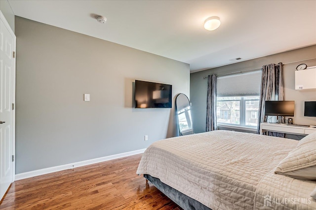 1142 Warren St, Roselle, NJ 07203 - bedroom with wood finished floors and baseboards