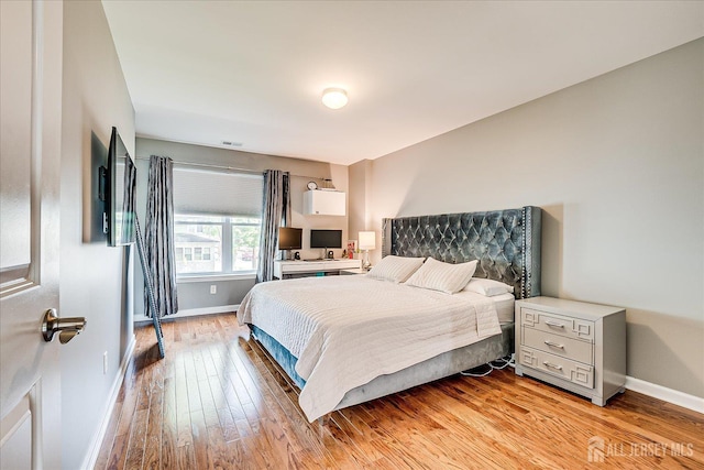 1142 Warren St, Roselle, NJ 07203 - bedroom featuring baseboards and light wood-style flooring