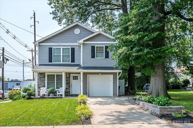 1142 Warren St, Roselle, NJ 07203 - view of front of property featuring covered porch, a front lawn, driveway, and a garage