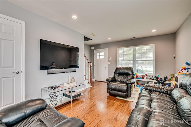 1142 Warren St, Roselle, NJ 07203 - living area with stairway, wood finished floors, and recessed lighting