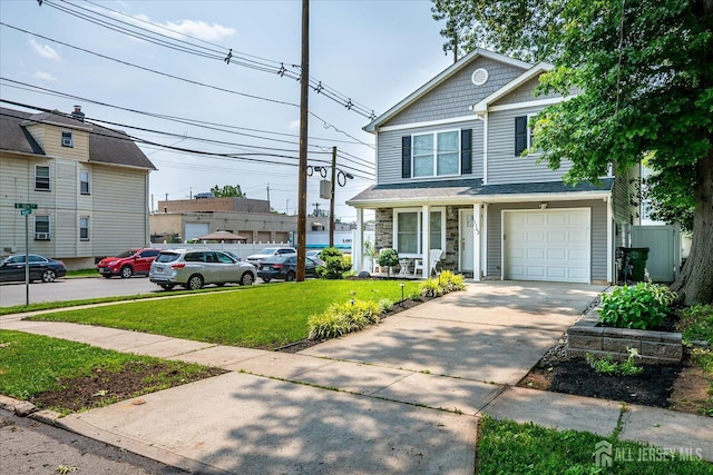1142 Warren St, Roselle, NJ 07203 - view of front of property featuring a front lawn, a garage, a porch, stone siding, and concrete driveway