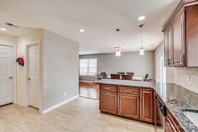 1142 Warren St, Roselle, NJ 07203 - kitchen with a peninsula, light tile patterned floors, dishwasher, tasteful backsplash, and recessed lighting