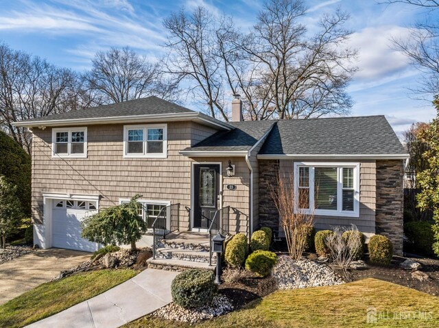 split level home with a garage