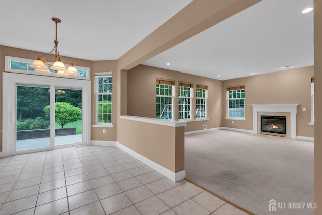 3 Malibu Ct, Jackson, NJ 08527 - unfurnished living room with healthy amount of natural light, recessed lighting, a chandelier, and a fireplace with flush hearth