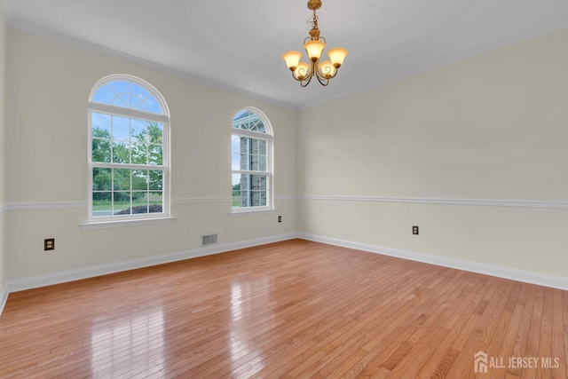 3 Malibu Ct, Jackson, NJ 08527 - unfurnished room featuring a chandelier and light wood finished floors