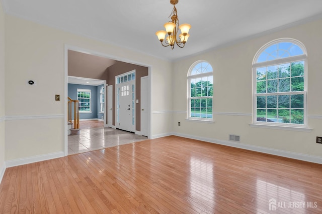 3 Malibu Ct, Jackson, NJ 08527 - spare room with a chandelier, healthy amount of natural light, and hardwood / wood-style flooring