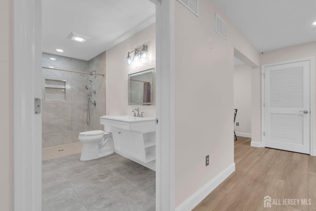 3 Malibu Ct, Jackson, NJ 08527 - bathroom with tiled shower, vanity, recessed lighting, and wood finished floors