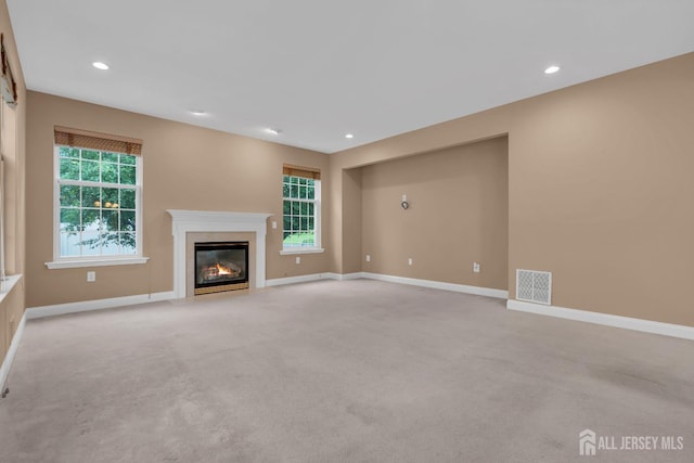 3 Malibu Ct, Jackson, NJ 08527 - unfurnished living room with light colored carpet, a high end fireplace, and recessed lighting