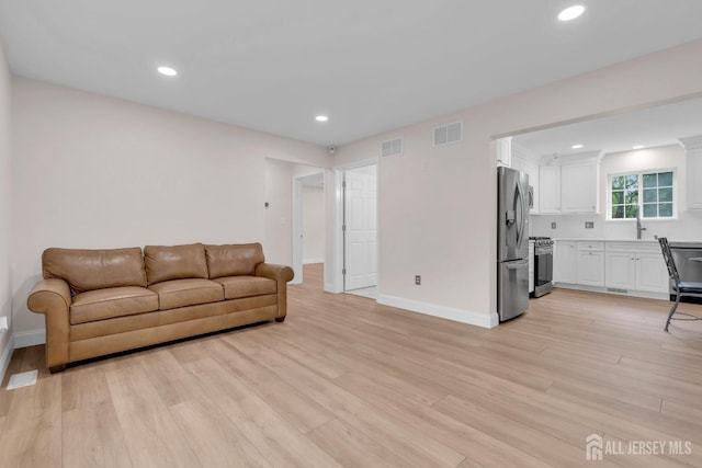 3 Malibu Ct, Jackson, NJ 08527 - living room with light wood finished floors and recessed lighting