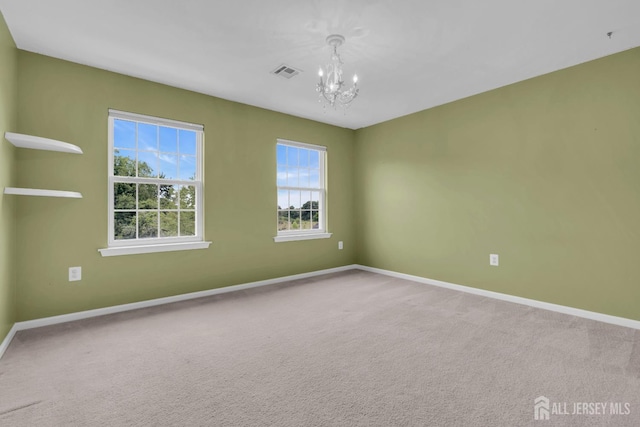 3 Malibu Ct, Jackson, NJ 08527 - spare room with a chandelier and carpet
