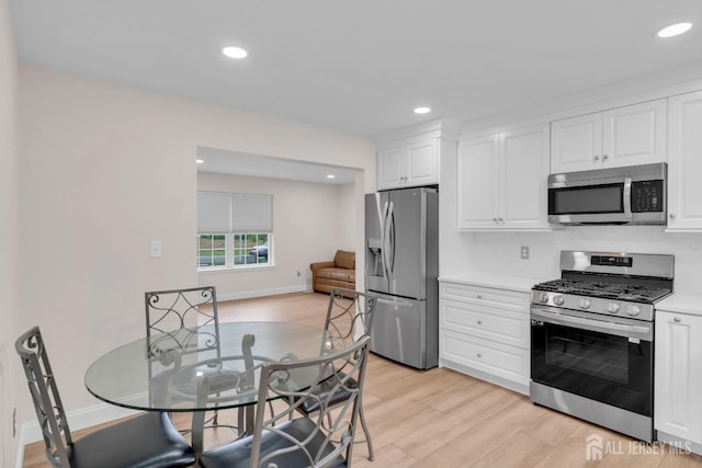 3 Malibu Ct, Jackson, NJ 08527 - kitchen with appliances with stainless steel finishes, light wood-type flooring, white cabinetry, light countertops, and recessed lighting