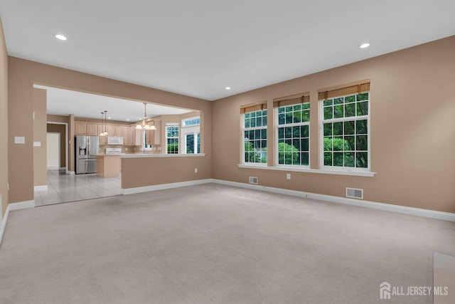 3 Malibu Ct, Jackson, NJ 08527 - unfurnished living room with light carpet, recessed lighting, and a chandelier