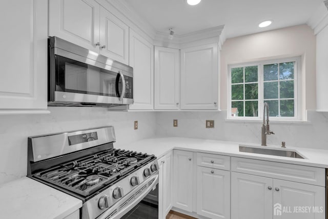 3 Malibu Ct, Jackson, NJ 08527 - kitchen featuring stainless steel appliances, white cabinetry, light countertops, tasteful backsplash, and recessed lighting